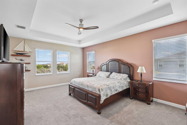 1104 Wandering Willow Way, Loxahatchee, FL 33470 - carpeted bedroom with ceiling fan, a tray ceiling, visible vents, and baseboards