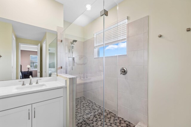 1104 Wandering Willow Way, Loxahatchee, FL 33470 - bathroom with vanity, a stall shower, and ensuite bath