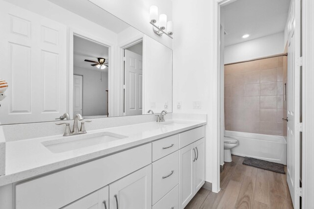 1104 Wandering Willow Way, Loxahatchee, FL 33470 - full bath with a sink, toilet, double vanity, and wood finished floors