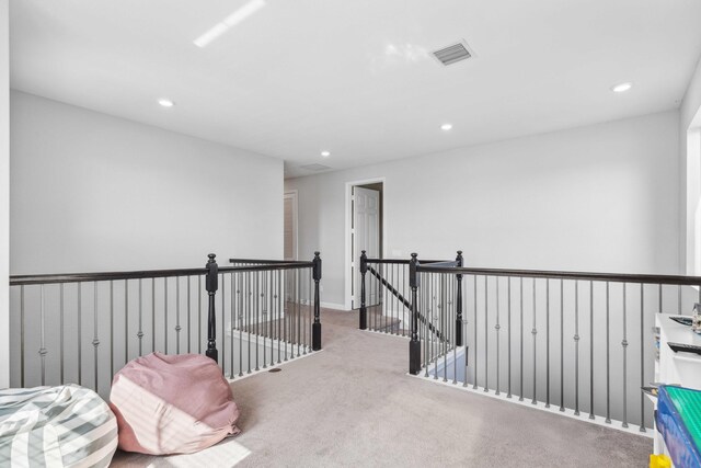 1104 Wandering Willow Way, Loxahatchee, FL 33470 - corridor featuring visible vents, recessed lighting, carpet floors, and an upstairs landing