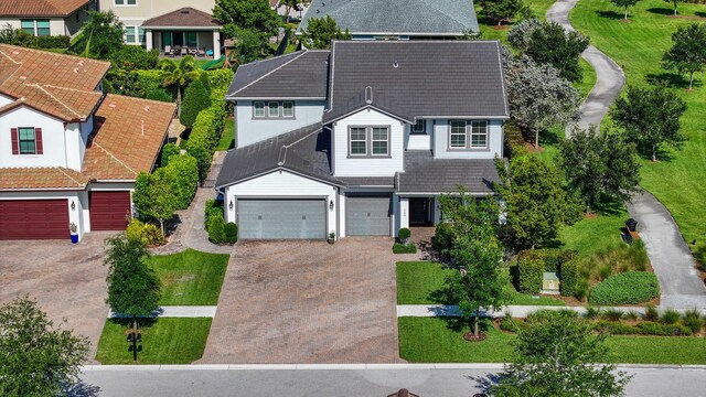 1104 Wandering Willow Way, Loxahatchee, FL 33470 - view of front of house with a residential view and concrete driveway