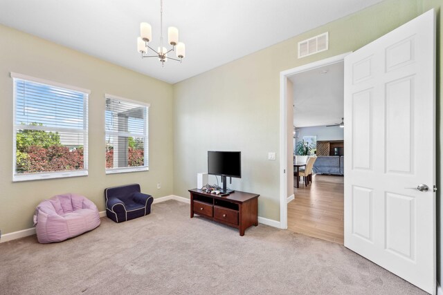 1104 Wandering Willow Way, Loxahatchee, FL 33470 - sitting room featuring carpet floors, baseboards, a notable chandelier, and visible vents