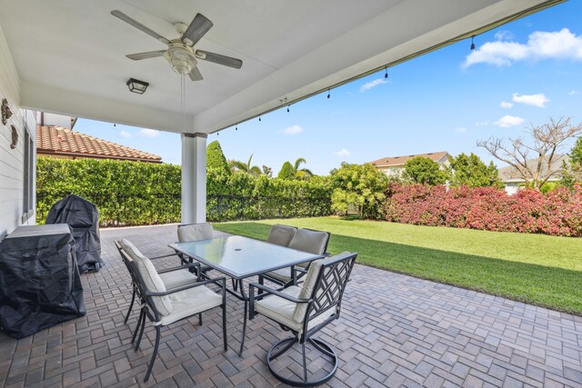 1104 Wandering Willow Way, Loxahatchee, FL 33470 - view of patio featuring ceiling fan and outdoor dining space