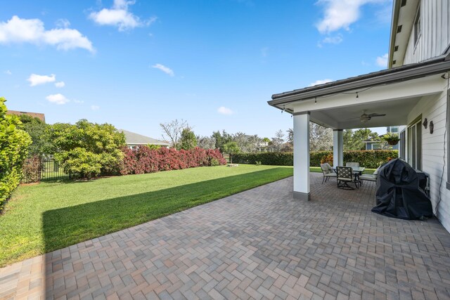 1104 Wandering Willow Way, Loxahatchee, FL 33470 - view of patio / terrace featuring ceiling fan, fence, and outdoor dining space