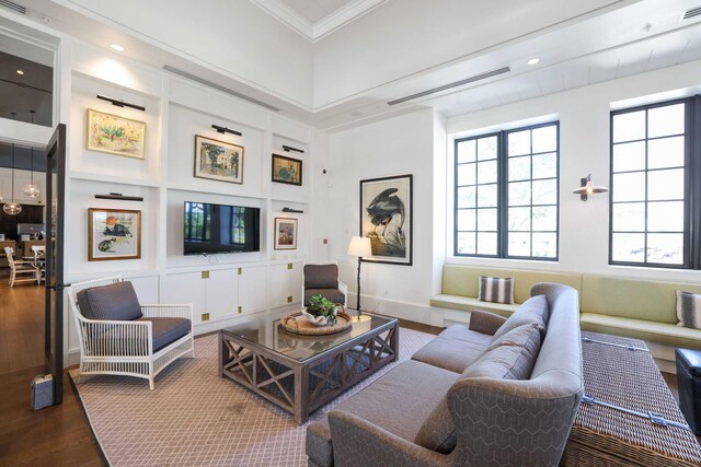 1104 Wandering Willow Way, Loxahatchee, FL 33470 - living room featuring baseboards, ornamental molding, wood finished floors, and visible vents