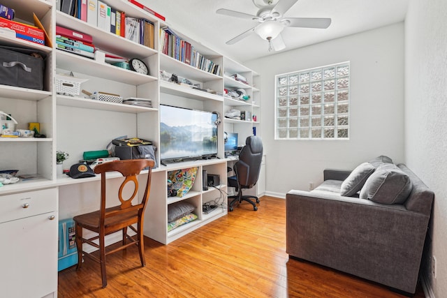 1070 Grove Park Cir, Boynton Beach, FL 33436 - home office with built in study area, wood finished floors, and ceiling fan