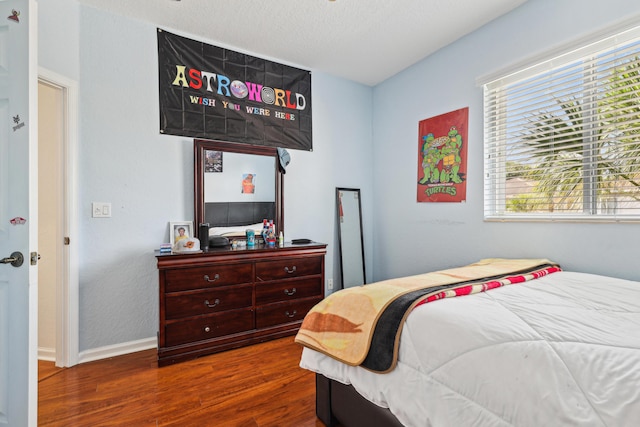 1070 Grove Park Cir, Boynton Beach, FL 33436 - bedroom featuring baseboards and dark wood-style floors