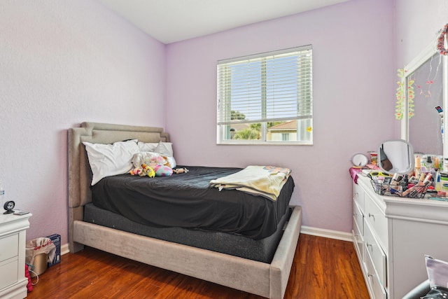 1070 Grove Park Cir, Boynton Beach, FL 33436 - bedroom with baseboards and dark wood finished floors