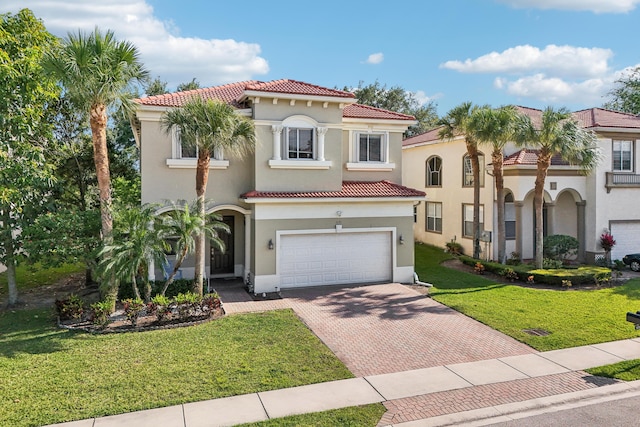 1070 Grove Park Cir, Boynton Beach, FL 33436 - mediterranean / spanish home featuring stucco siding, an attached garage, decorative driveway, and a tiled roof