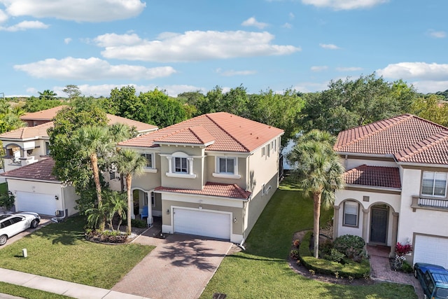 1070 Grove Park Cir, Boynton Beach, FL 33436 - mediterranean / spanish house with concrete driveway, a front lawn, a tiled roof, an attached garage, and stucco siding