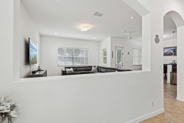 1070 Grove Park Cir, Boynton Beach, FL 33436 - living area with arched walkways, visible vents, tile patterned flooring, and recessed lighting