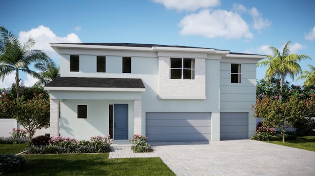 contemporary house with a garage, stucco siding, a front lawn, and decorative driveway