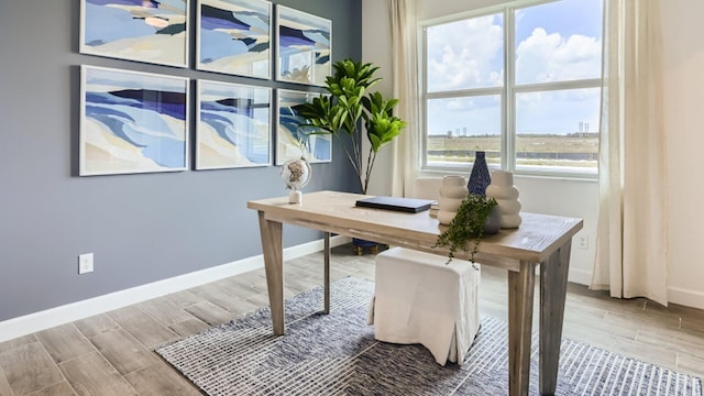 office with wood finished floors and baseboards