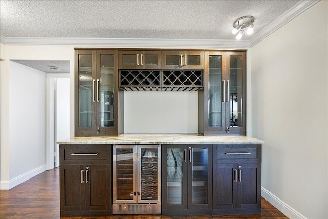 7572 Regency Lake Dr Unit 501, Boca Raton, FL 33433 - indoor dry bar featuring beverage cooler, a textured ceiling, baseboards, crown molding, and dark wood-style floors