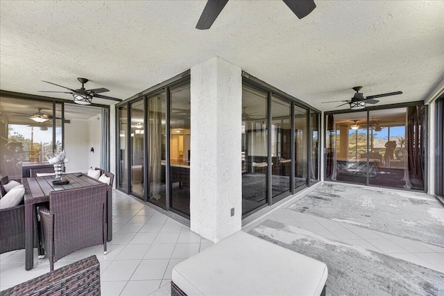 7572 Regency Lake Dr Unit 501, Boca Raton, FL 33433 - sunroom / solarium with ceiling fan, a textured ceiling, and a wall of windows