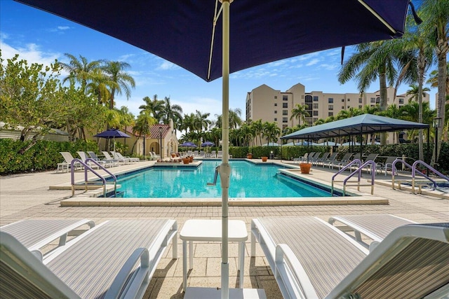 7572 Regency Lake Dr Unit 501, Boca Raton, FL 33433 - community pool with a patio