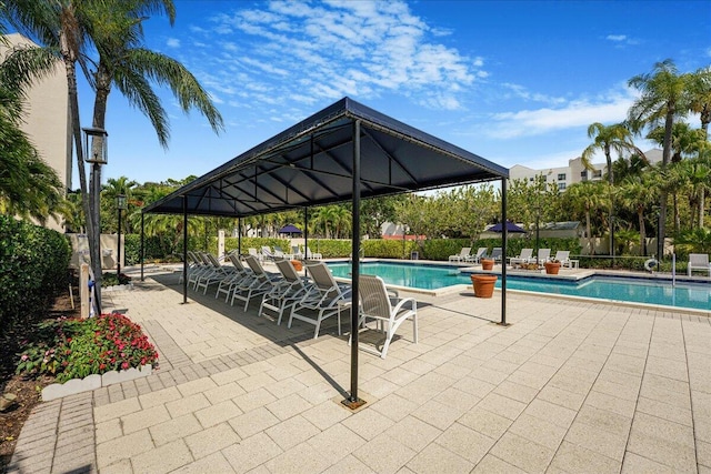 7572 Regency Lake Dr Unit 501, Boca Raton, FL 33433 - community pool featuring a gazebo and a patio