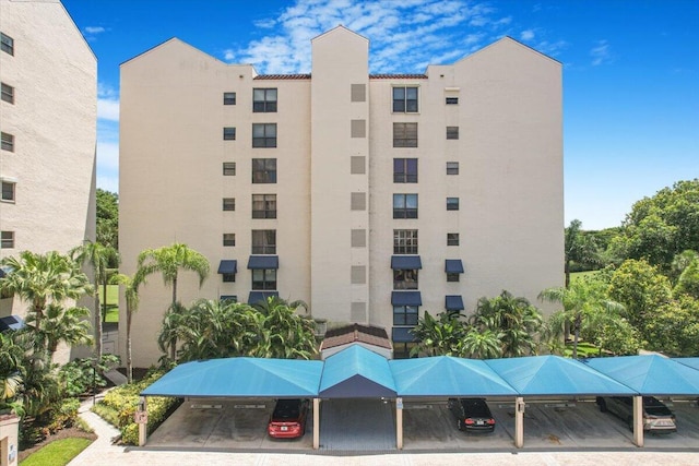 7572 Regency Lake Dr Unit 501, Boca Raton, FL 33433 - view of apartment building / complex with covered parking