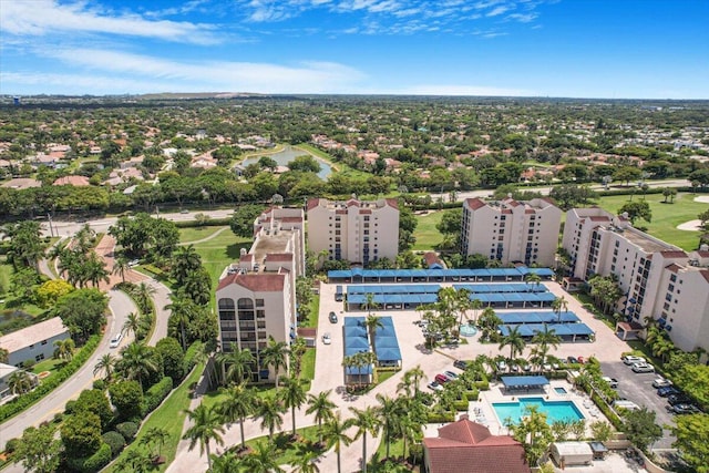 7572 Regency Lake Dr Unit 501, Boca Raton, FL 33433 - bird's eye view of a pool area, apartment complex, and a large body of water