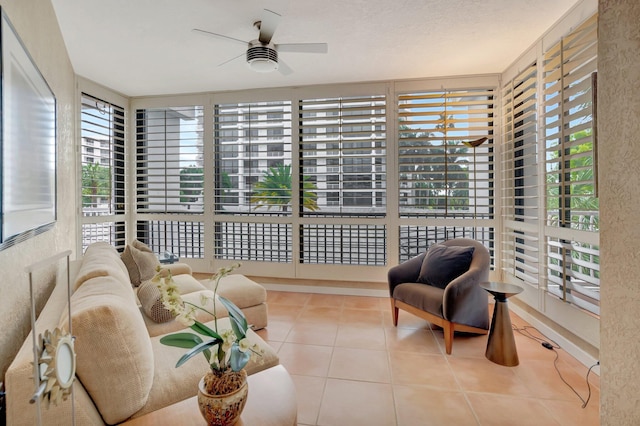 sunroom with plenty of natural light and tile patterned floors