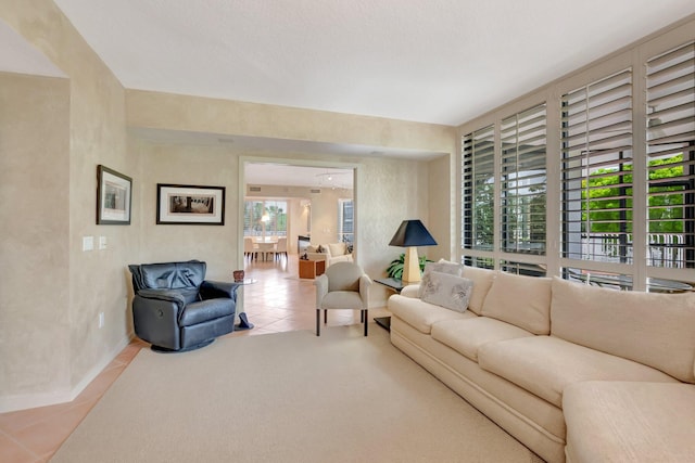 living area with tile patterned floors