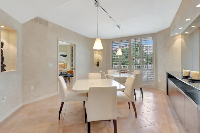 dining space with light tile patterned floors, track lighting, visible vents, baseboards, and recessed lighting