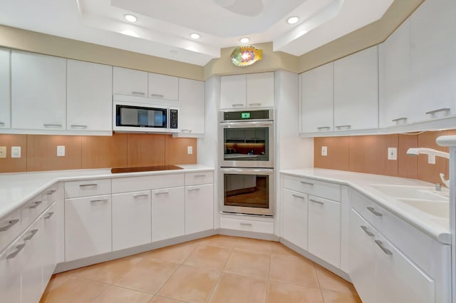 kitchen with recessed lighting, white cabinets, and appliances with stainless steel finishes