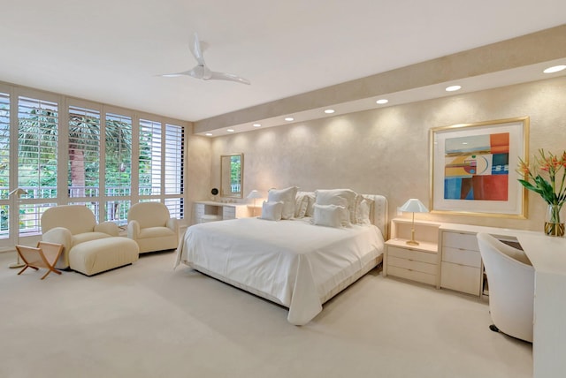 bedroom with a ceiling fan, light carpet, and recessed lighting