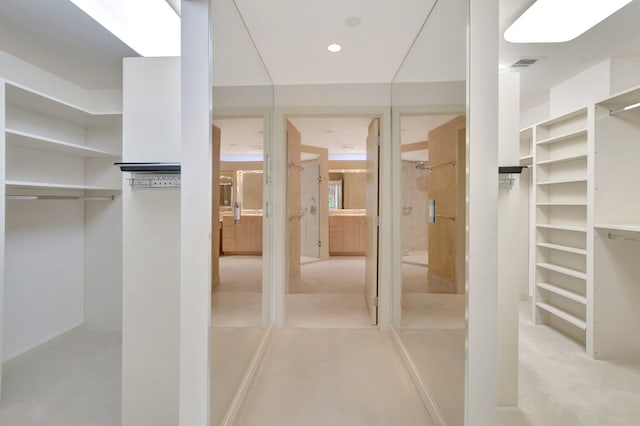 walk in closet with visible vents