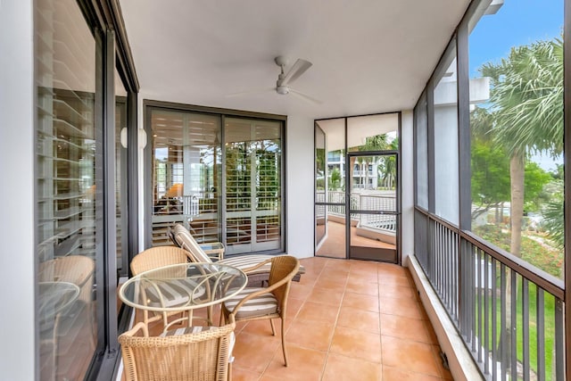 sunroom featuring ceiling fan