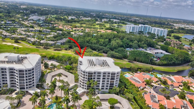 aerial view featuring view of golf course and a water view