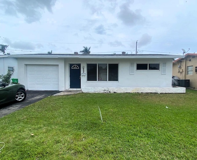 single story home with a garage, driveway, central AC, and a front yard