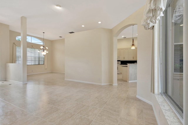 5266 Landon Cir, Boynton Beach, FL 33437 - unfurnished room with light tile patterned floors, arched walkways, visible vents, recessed lighting, and a chandelier