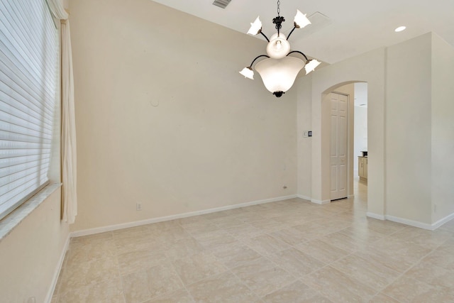 5266 Landon Cir, Boynton Beach, FL 33437 - spare room with visible vents, baseboards, arched walkways, and a notable chandelier
