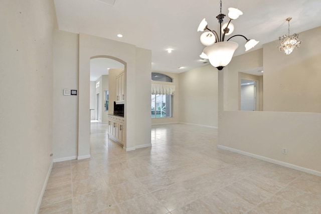 5266 Landon Cir, Boynton Beach, FL 33437 - spare room with a chandelier, arched walkways, and baseboards