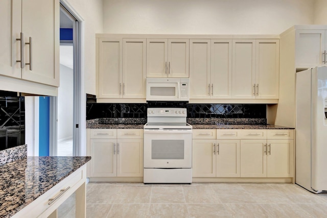 5266 Landon Cir, Boynton Beach, FL 33437 - kitchen with tasteful backsplash, dark stone counters, and white appliances