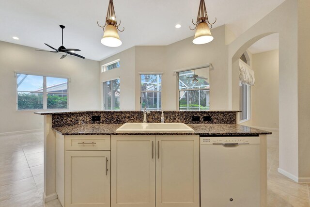 5266 Landon Cir, Boynton Beach, FL 33437 - kitchen with dark stone counters, a sink, a ceiling fan, and white dishwasher