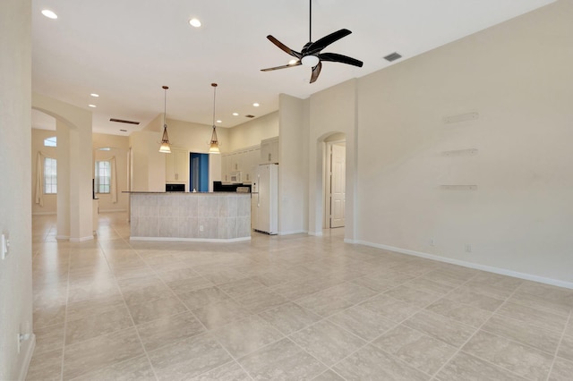 5266 Landon Cir, Boynton Beach, FL 33437 - unfurnished living room with ceiling fan, arched walkways, visible vents, recessed lighting, and baseboards