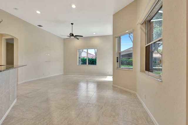 5266 Landon Cir, Boynton Beach, FL 33437 - unfurnished room featuring recessed lighting, arched walkways, baseboards, and a ceiling fan
