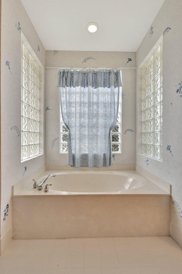 5266 Landon Cir, Boynton Beach, FL 33437 - bathroom featuring tile patterned floors and a garden tub