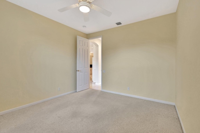 5266 Landon Cir, Boynton Beach, FL 33437 - spare room with visible vents, baseboards, arched walkways, and light colored carpet