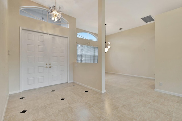 5266 Landon Cir, Boynton Beach, FL 33437 - entryway with an inviting chandelier, baseboards, tile patterned flooring, and visible vents
