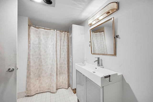 full bath with tile patterned flooring