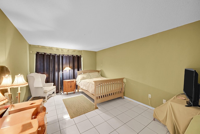bedroom featuring light tile patterned floors