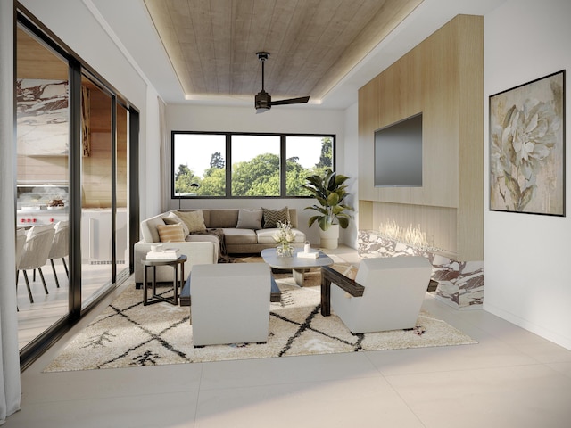 living area with baseboards, a raised ceiling, wooden ceiling, and a ceiling fan