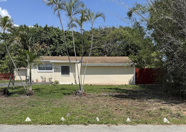 view of side of home featuring a yard