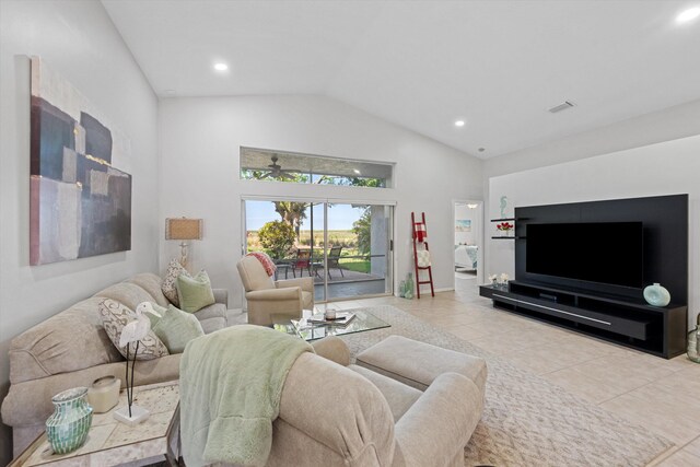 tiled living area featuring baseboards, visible vents, recessed lighting, and high vaulted ceiling