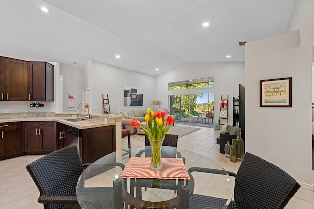 dining room with lofted ceiling, light tile patterned floors, and recessed lighting