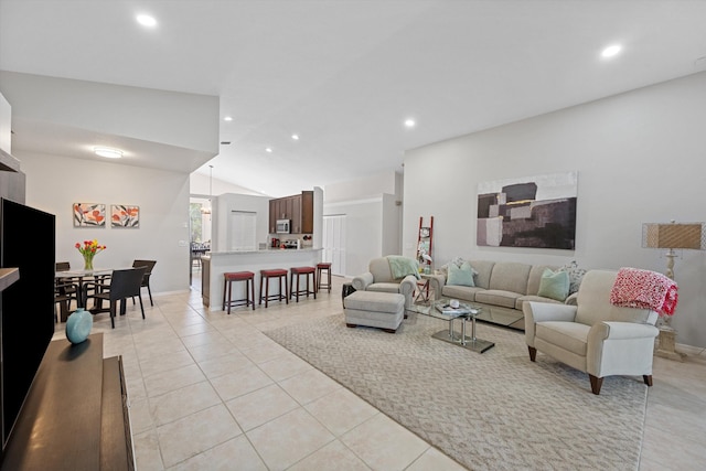 living room featuring baseboards, recessed lighting, light tile patterned floors, and lofted ceiling