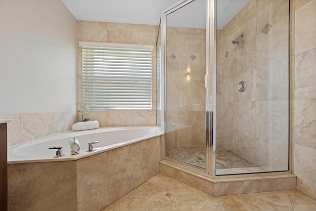 full bathroom with tile patterned floors, a stall shower, and a bath